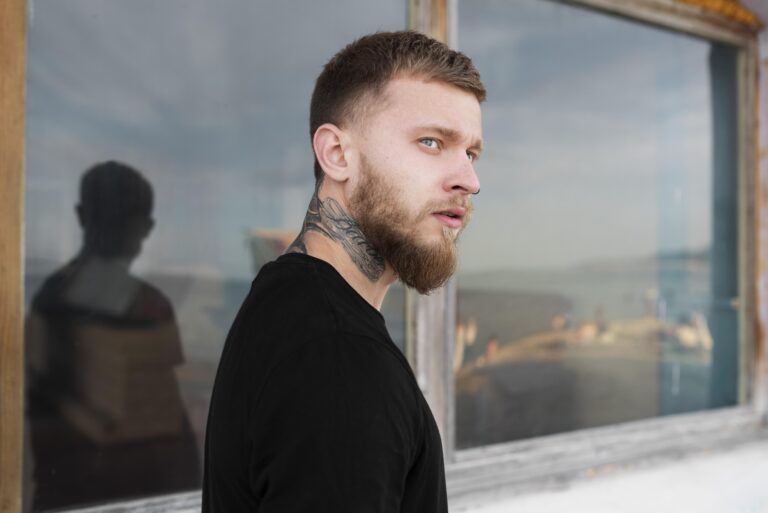 A stylish taper fade mullet haircut